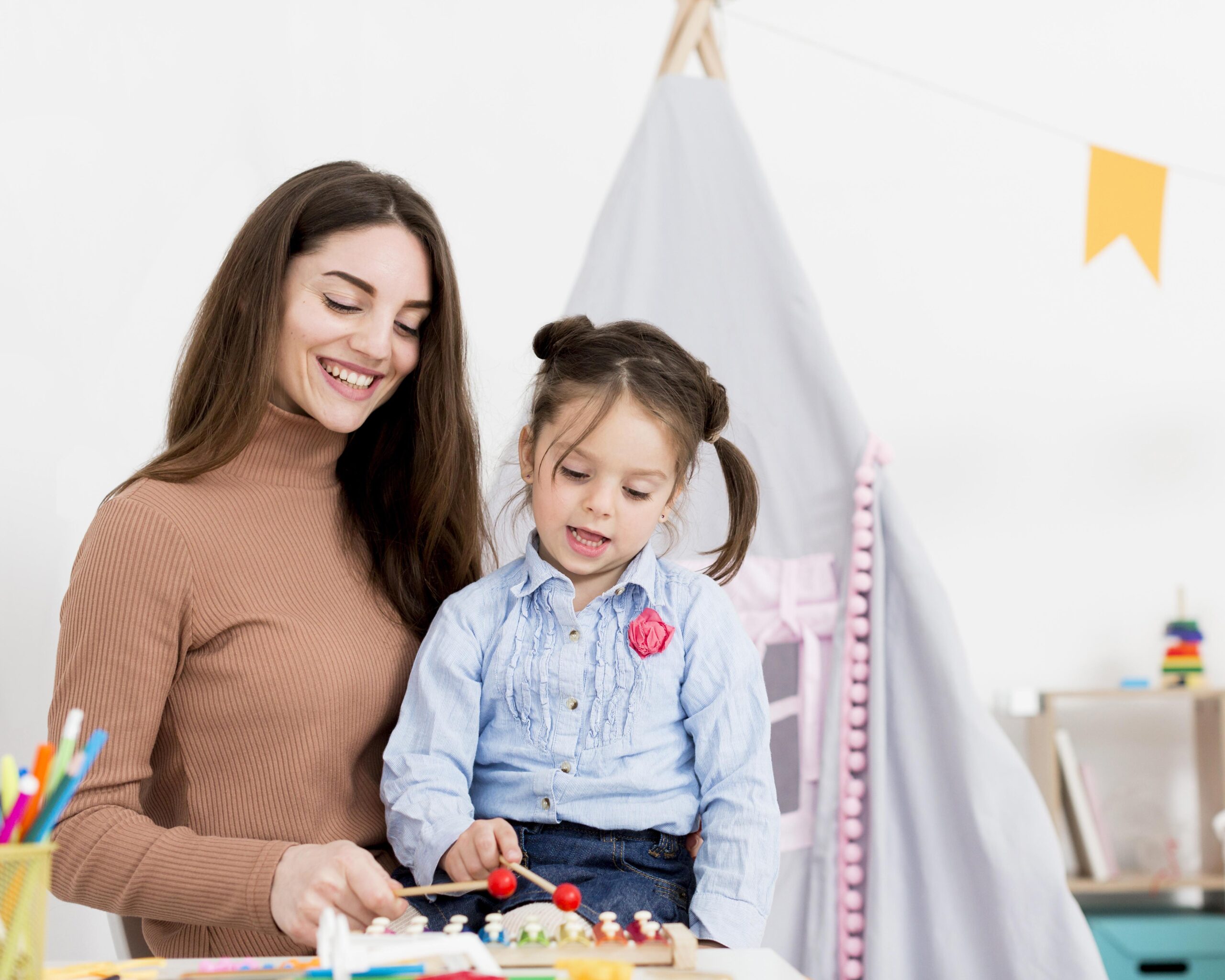 A Babysitter is palying with a baby girl | Babysitting Service in Qatar
