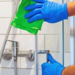 A House Maid In Qatar is cleaning the Washroom.