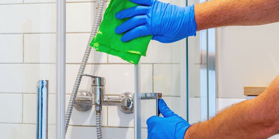 A House Maid In Qatar is cleaning the Washroom.