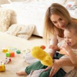 A professional lady babysitter in Qatar caring for a child with trust, safety at home.